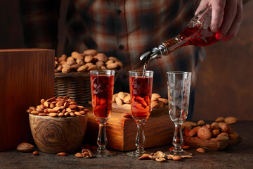 Italian liqueur Amaretto with almonds nuts.