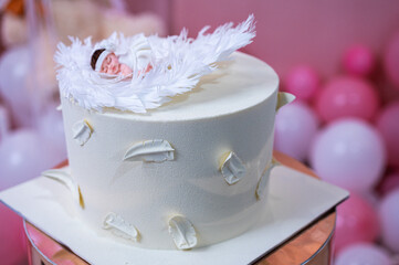 Christening cake in the form of a small child, bright and festive