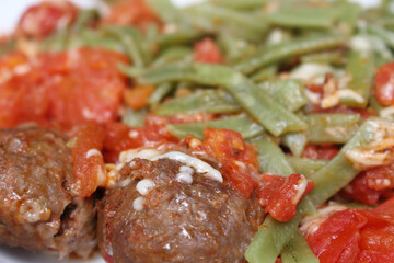 meatballs with sauce. pasta with sauce. meatball with red sauce and pasta. food with selective focus. food details. close up on meal.