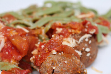 meatballs with sauce. pasta with sauce. meatball with red sauce and pasta. food with selective focus. food details. close up on meal.