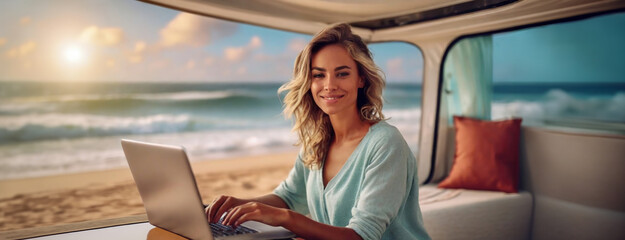 Living and working inside camper van vehicle in travel and digital nomad free lifestyle. Smiling woman sitting in a motorhome and enjoy relax with laptop. Beach background outside the window. - obrazy, fototapety, plakaty