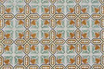 Vintage tiles of pale old-fashioned colour with floral ornament in Lisbon, Portugal
