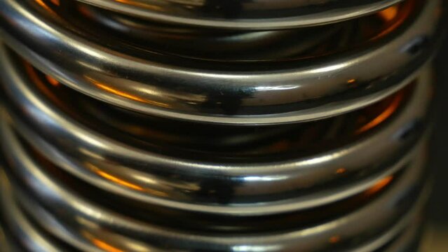Spinning metal spiral close-up background