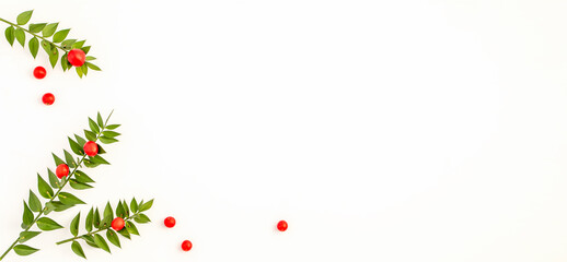 Merry Christmas and Happy Holidays greeting card, banner. White background with decoration ornaments red and green. New Year. Flat lay. With copy space  © Anzhela