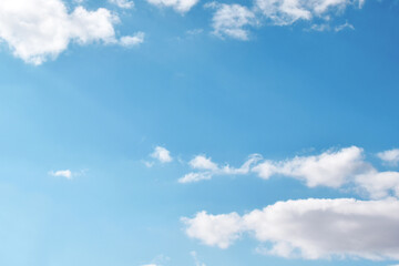 Blue sky with white fluffy cloud. Cumulus clouds background. Cloudscape morning sky. The concepts of freedom of live, never give up and positive though energy.