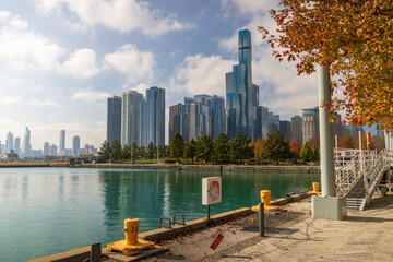 A beautiful autumn landscape along Lake Michigan with skyscrapers, hotels and office buildings in...