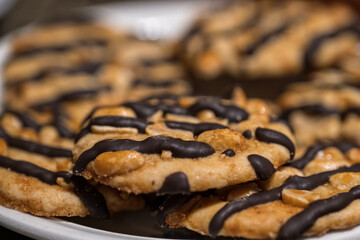 Hazelnut biscuit with chocolate on top.