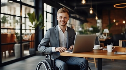 Portrait of businessman in wheelchair working on laptop. Smiling disabled person in suit with success in business. Modern office or cafe freelance remote work place.