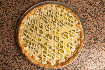 Pickle pizza on a tray