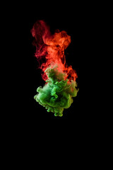 Contrasting Chroma: Red and Green Swirling Fumes on Abyssal Black Canvas - Vivid Shades Coalescing in Enigmatic Whirls