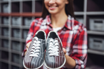 Girl with bowling shoes