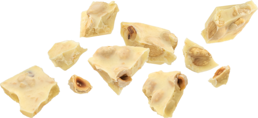 Broken white chocolate bar with hazelnut isolated