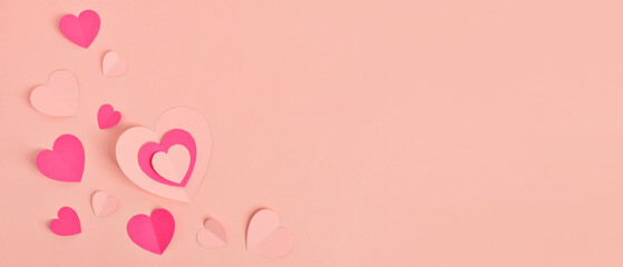 Different paper hearts on pink background with space for text, top view. Valentine's Day celebration