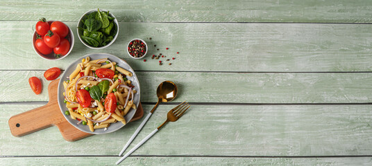Bowl with tasty pasta salad on wooden background with space for text