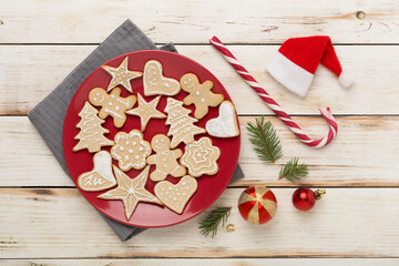 Cute homemade Christmas cookies with decor on color background,top view