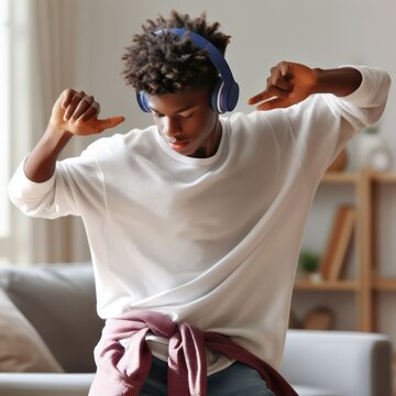 teenager dancing to music at home