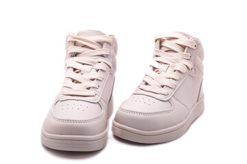 Sports leather shoes in cream color with soft soles. Casual sneakers with laces.