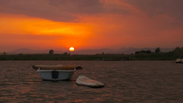 Boat for surfing against evening clouds. A view of evening time under the surfing boat in the sea during summer time.