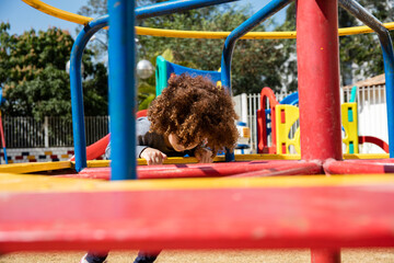 Causasian redhead girl playing in playground