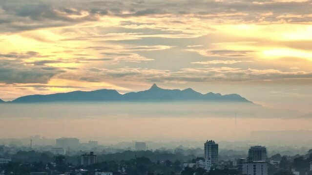 Breathtaking beauty of a scenic sunrise over Sri Pada - Adam's Peak. 4k aerial video.