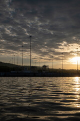 Dramatic Sky with Silhouettes of Poles, Sunset in the Port of La Union in Salvador