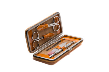 Set of steel manicure instruments and tools in orange leather case isolated on white background.