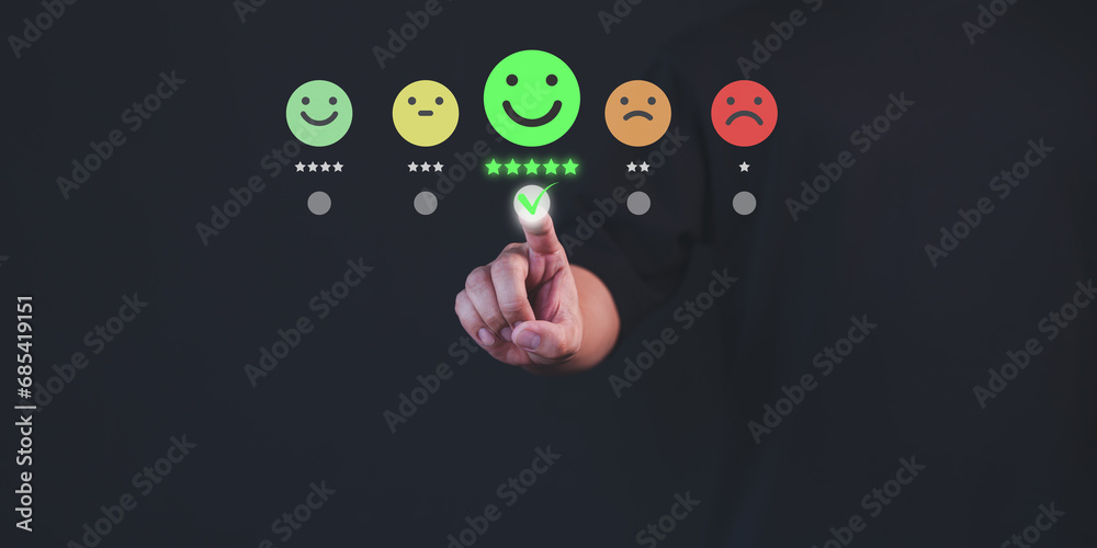 Poster Customer hand touch virtual screen on happy smile face icon to give satisfaction in service. Online review concept of assessment testimonial customer service and feedback, Opinion rating very good.