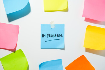 Motivational words for personal development, in progress, inspirational handwriting on sticky notes