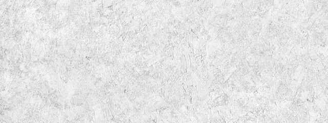 Abstract light grey plastered textured grunge background, horizontal banner, in the form of a rough covered stucco wall, closeup