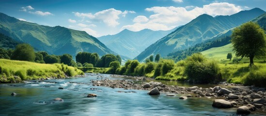 The Salat river and the Pyrenees in Saint Girons, Ariege, France.