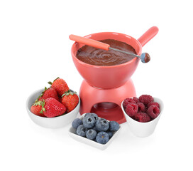Fondue pot with melted chocolate, fresh berries and fork isolated on white