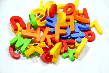 Colourful alphabet character written in multicolored plastic for kids. kids learn letters.
