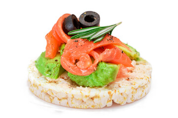 Rice Cake Sandwich with Fresh Salmon, Avocado and Olives - Isolated on White. Easy Breakfast. Diet Food. Quick and Healthy Sandwiches. Crispbread with Tasty Filling. Healthy Dietary Snack - Isolation