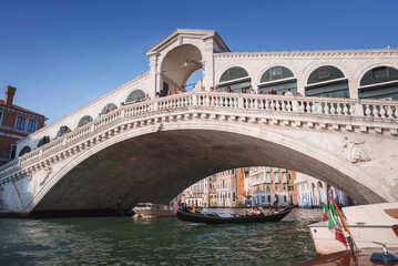Experience the timeless beauty of the iconic Rialto Bridge in Venice, Italy. This stunning shot...