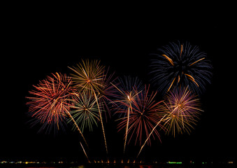 Fireworks show under defocus or blur concepts with isolated black background at night, this celebration is for the International Fireworks Festival in Pattaya on Nov 24-25 in Thailand.