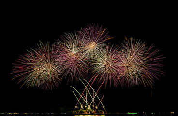 Fireworks show under defocus or blur concepts with isolated black background at night, this celebration is for the International Fireworks Festival in Pattaya on Nov 24-25 in Thailand.