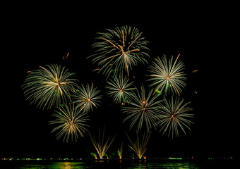 Fireworks show under defocus or blur concepts with isolated black background at night, this celebration is for the International Fireworks Festival in Pattaya on Nov 24-25 in Thailand.