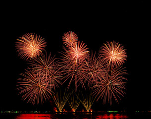 Fireworks show under defocus or blur concepts with isolated black background at night, this celebration is for the International Fireworks Festival in Pattaya on Nov 24-25 in Thailand.