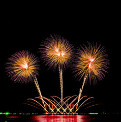 Fireworks show under defocus or blur concepts with isolated black background at night, this celebration is for the International Fireworks Festival in Pattaya on Nov 24-25 in Thailand.