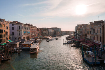 Fototapeta na wymiar Scenic view of boats cruising along the Grand Canal in Venice, Italy. Serene and picturesque scene with tranquil and beautiful atmosphere.