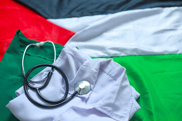 Portrait of stethoscope, doctor's uniform and Palestine flag