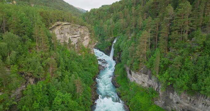 Cascades Along Rauma River Near Kylling Railway Bridge In M&oslash;re og Romsdal County, Norway. Aerial Drone Shot