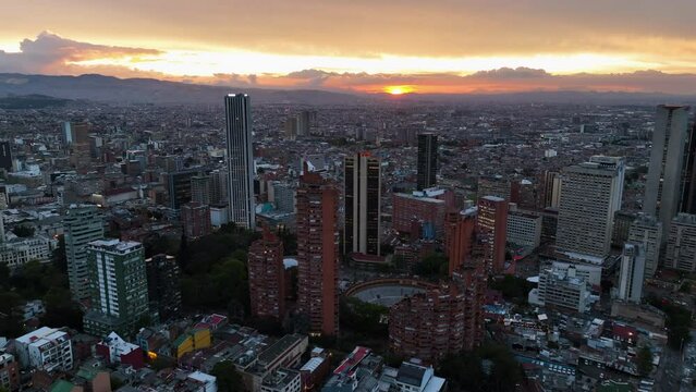 Aerial view circling the city center of Bogota, vibrant dusk in Colombia