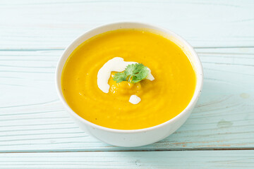 pumpkin soup in white bowl