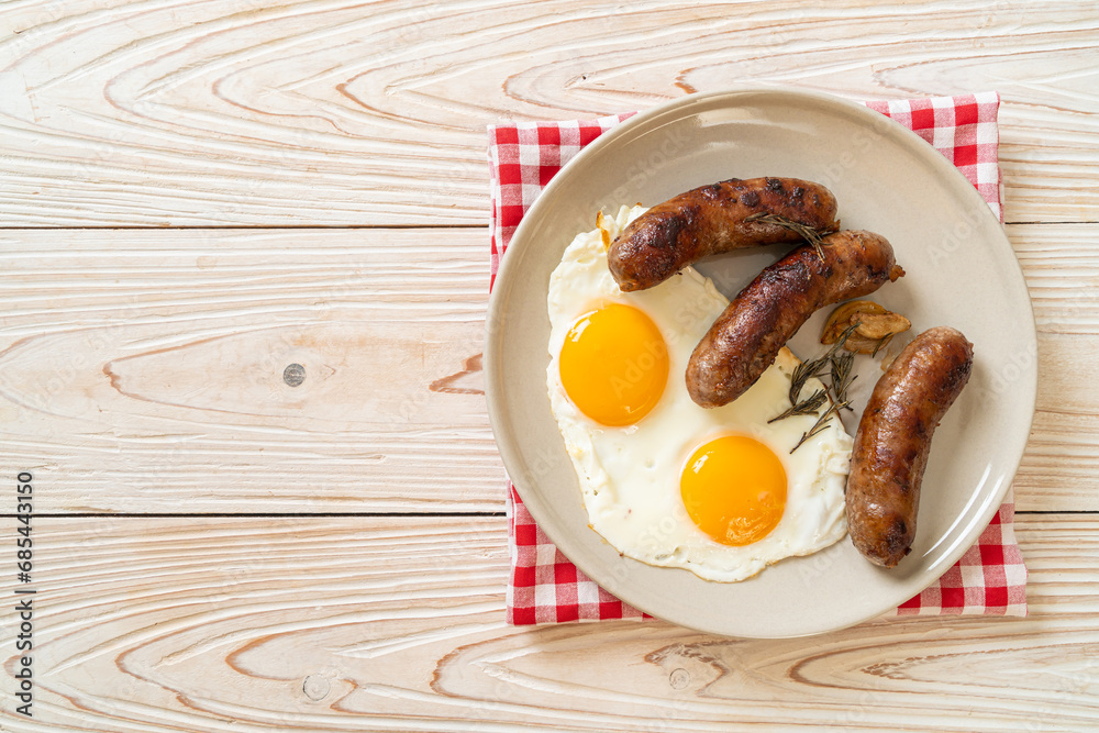 Wall mural double fried egg with pork sausage