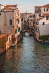 Fototapeta na wymiar Experience the charm of Venice with this stunning view of a canal in Italy. Capture the beauty of the iconic canals and colorful buildings in this timeless image.