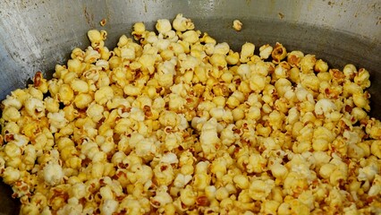 Cooking popcorn in a pan.