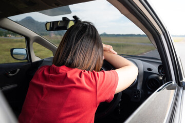 young woman sleeping When driving