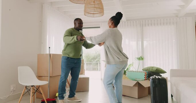 Black couple, moving in and celebrate at home with boxes in a room. New house, goals and excited african man and woman with commitment, help and support for apartment mortgage or rent at a property