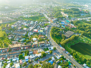 Fototapeta premium Aerial view drone Top down shot of beautiful green golf field with modern luxury villa, High angle view in summer day